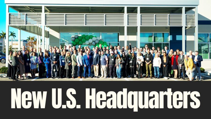 Employees, business leaders and officials stand outside a new U.S. headquarters building during a ribbon-cutting event in Palmetto, Florida.
