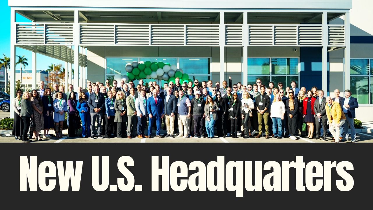 Employees, business leaders and officials stand outside a new U.S. headquarters building during a ribbon-cutting event in Palmetto, Florida.