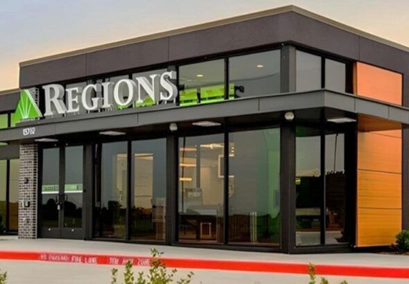 Exterior of a modern Regions Bank branch with the Regions sign above the entrance.