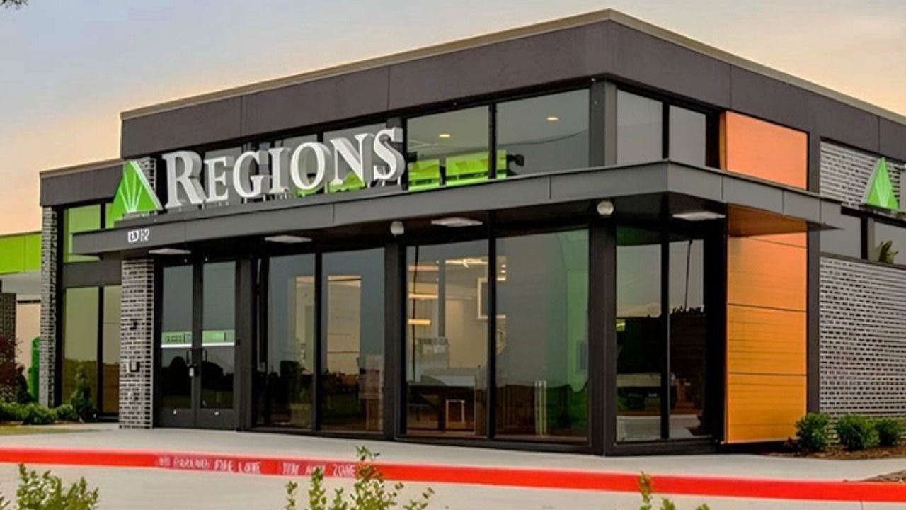 Exterior of a modern Regions Bank branch with the Regions sign above the entrance.