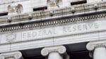 Federal Reserve building facade with carved “Federal Reserve” inscription and classical columns