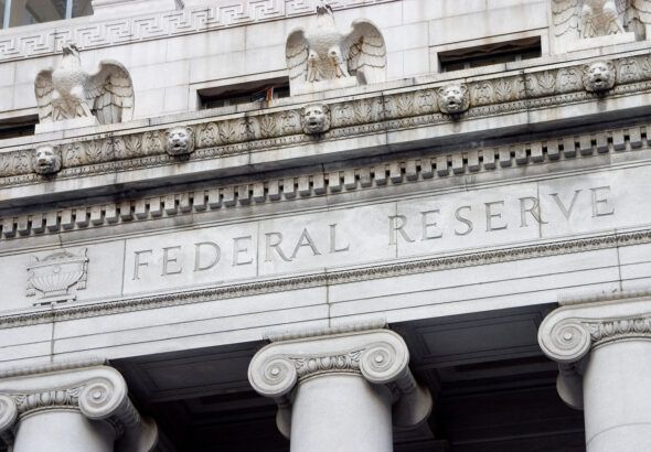Federal Reserve building facade with carved “Federal Reserve” inscription and classical columns
