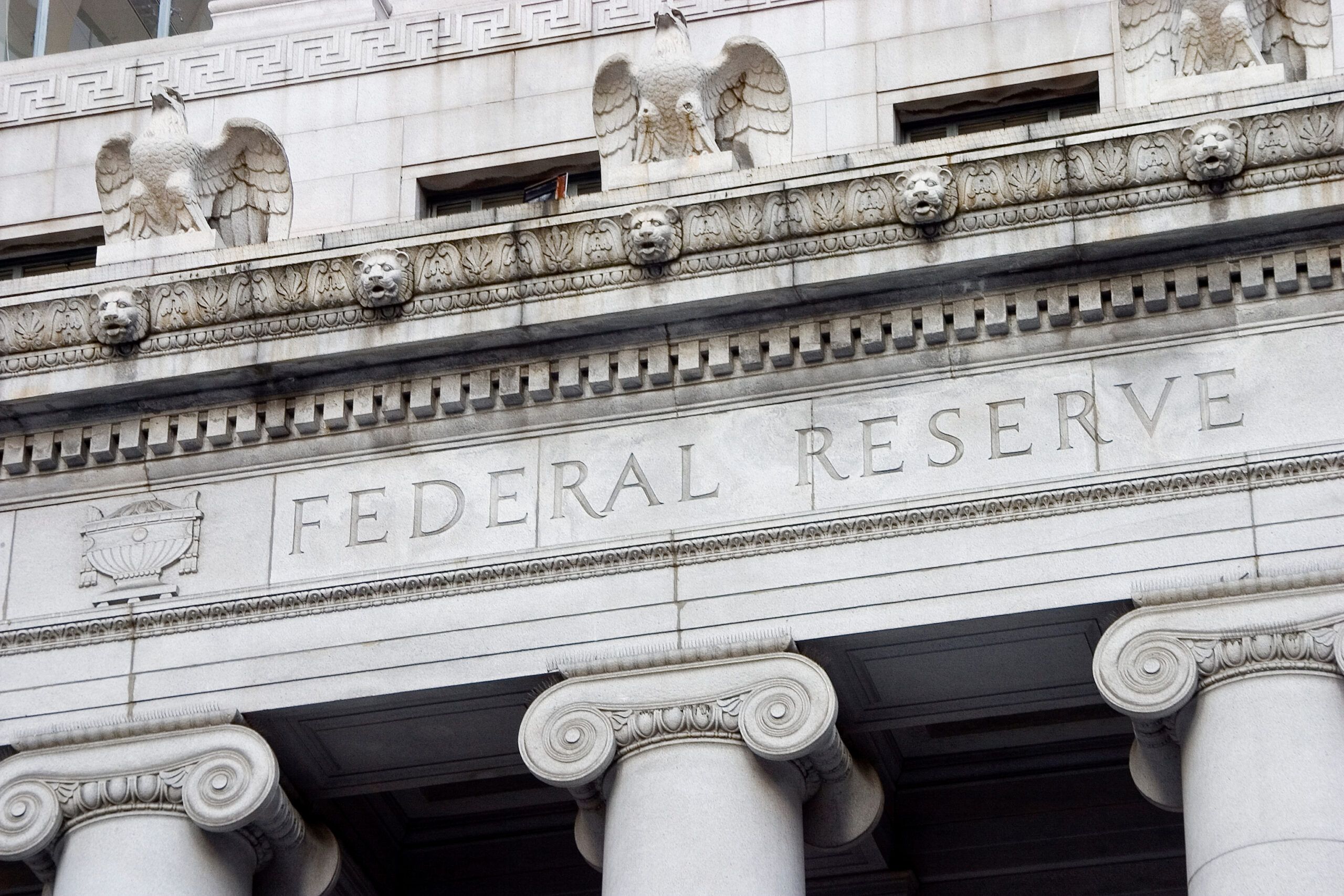 Federal Reserve building facade with carved “Federal Reserve” inscription and classical columns