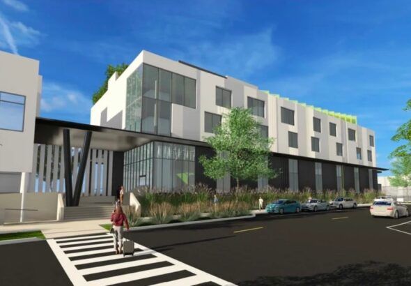 Rendering of proposed Maritime and Defense Technology Hub expansion at Port of St. Petersburg showing multi-story waterfront building with glass façade.