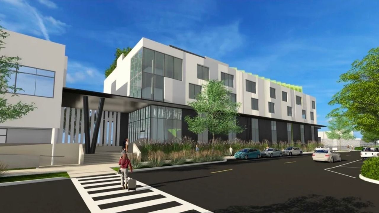 Rendering of proposed Maritime and Defense Technology Hub expansion at Port of St. Petersburg showing multi-story waterfront building with glass façade.