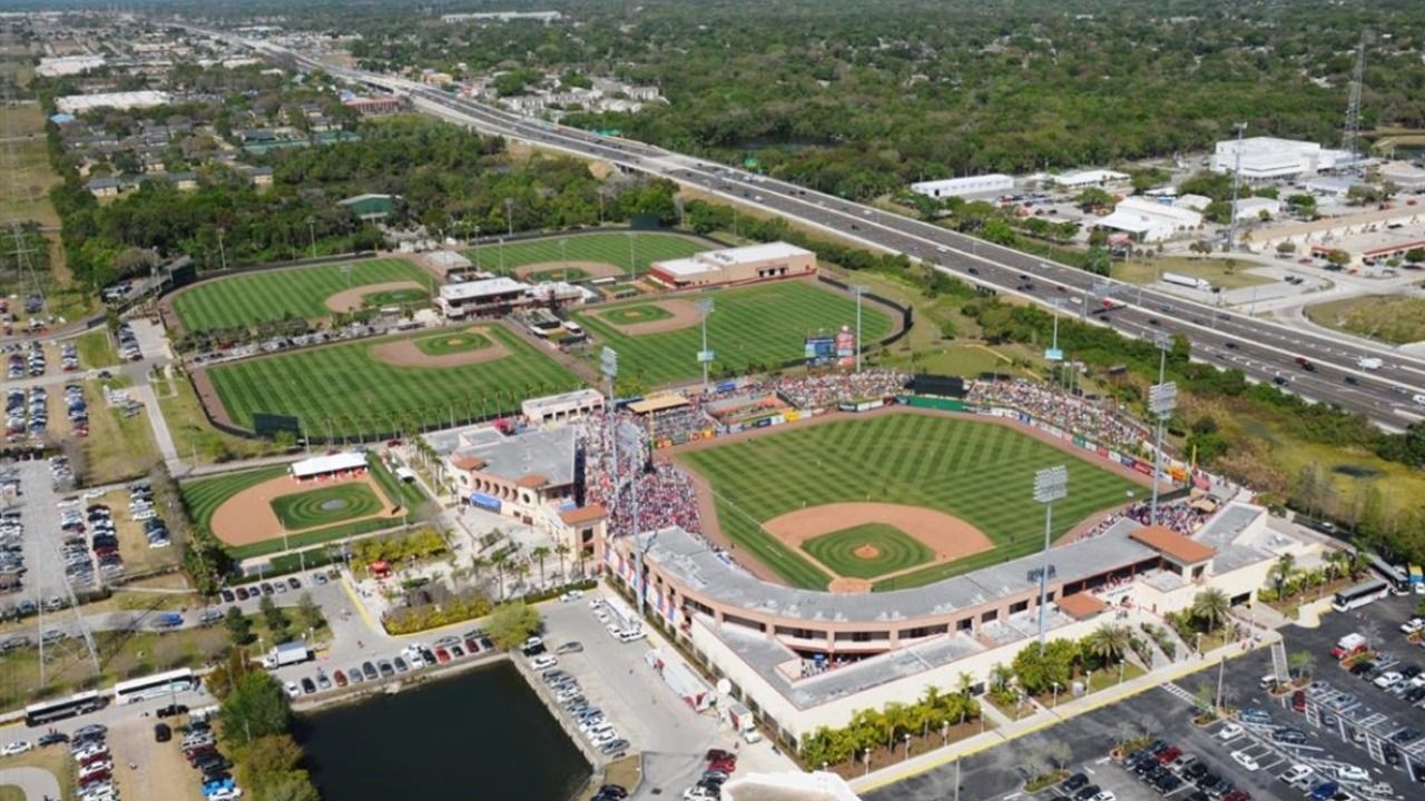 Aerial view of BayCare Ballpark in Clearwater, showing the stadium, outfield berm seating area and surrounding fields.
