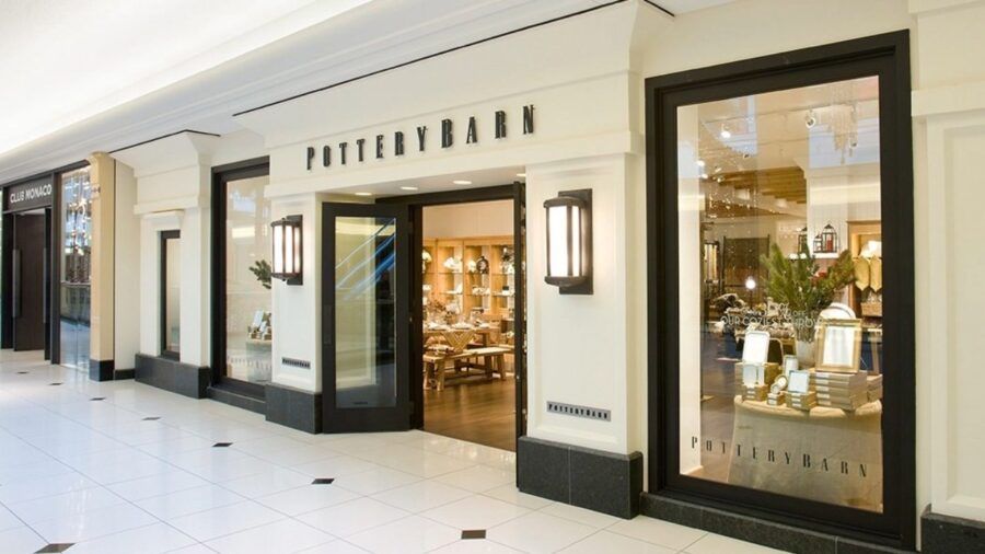 Pottery Barn storefront inside a shopping mall with home furnishings displays visible through the windows