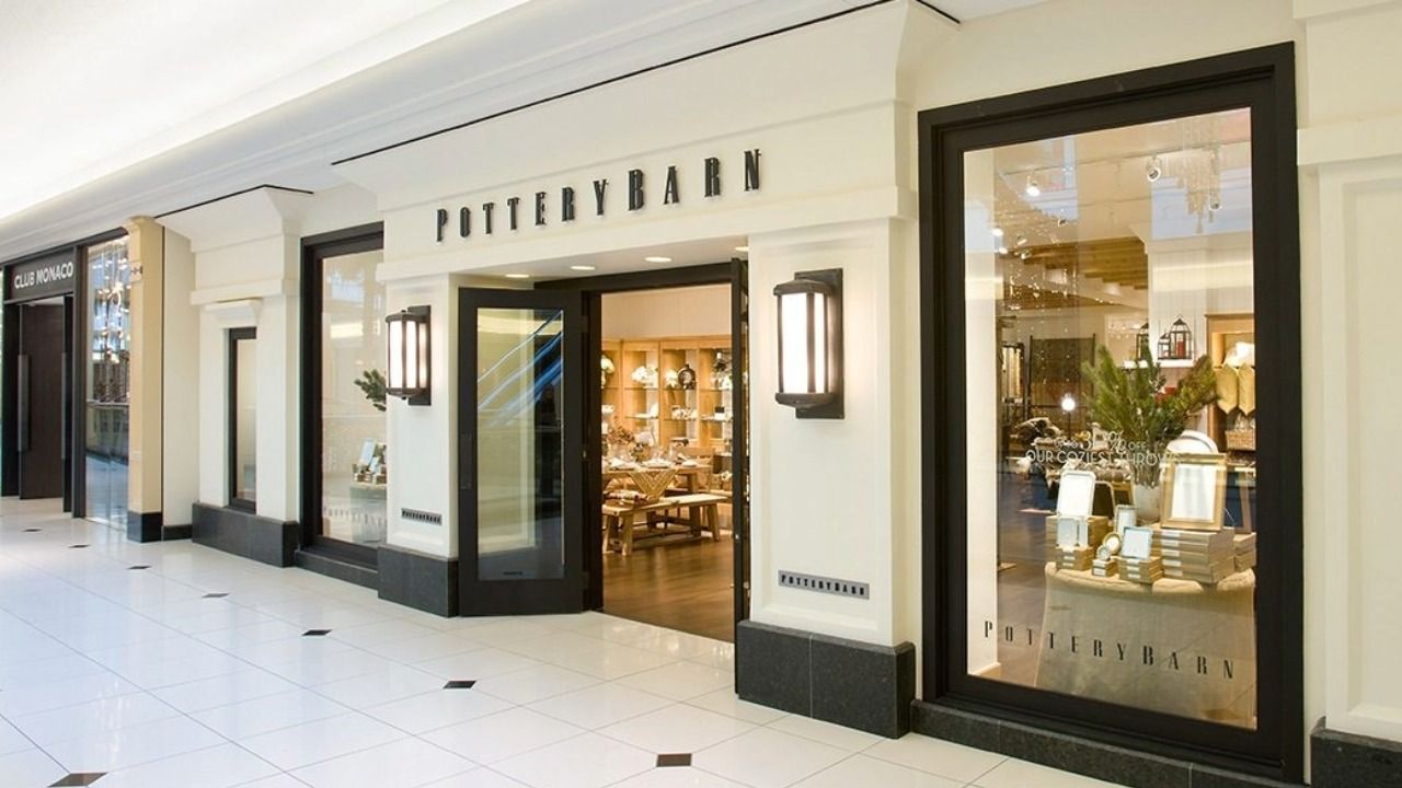 Pottery Barn storefront inside a shopping mall with home furnishings displays visible through the windows