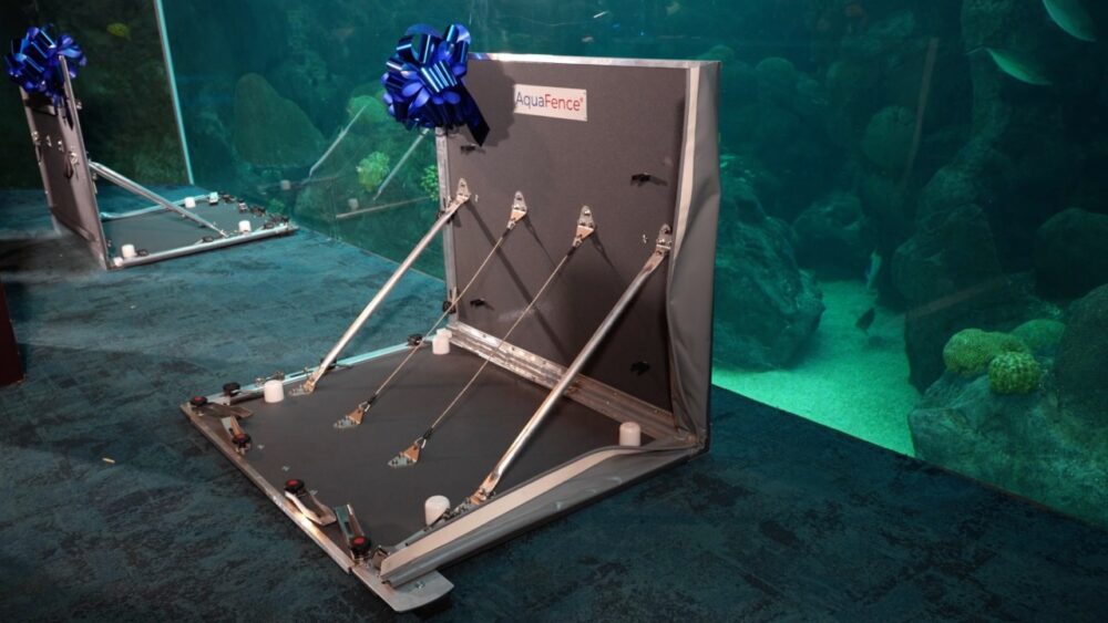 AquaFence flood barrier system installed inside The Florida Aquarium near a large marine exhibit