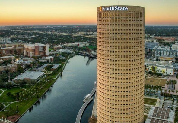 Rivergate Tower, known as the Beer Can Building, along the Hillsborough River in downtown Tampa