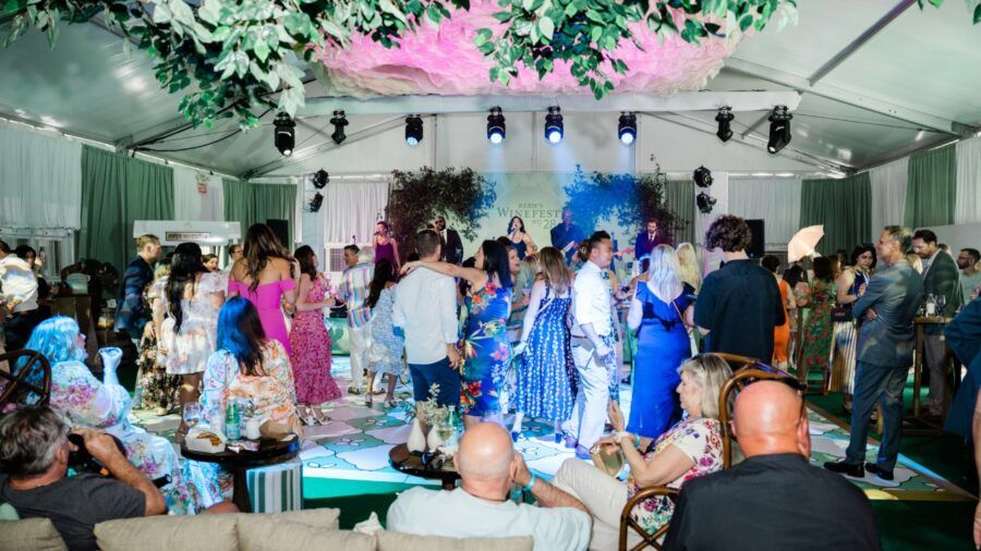Guests gather for live music and wine tasting at Bern’s Winefest event in Tampa