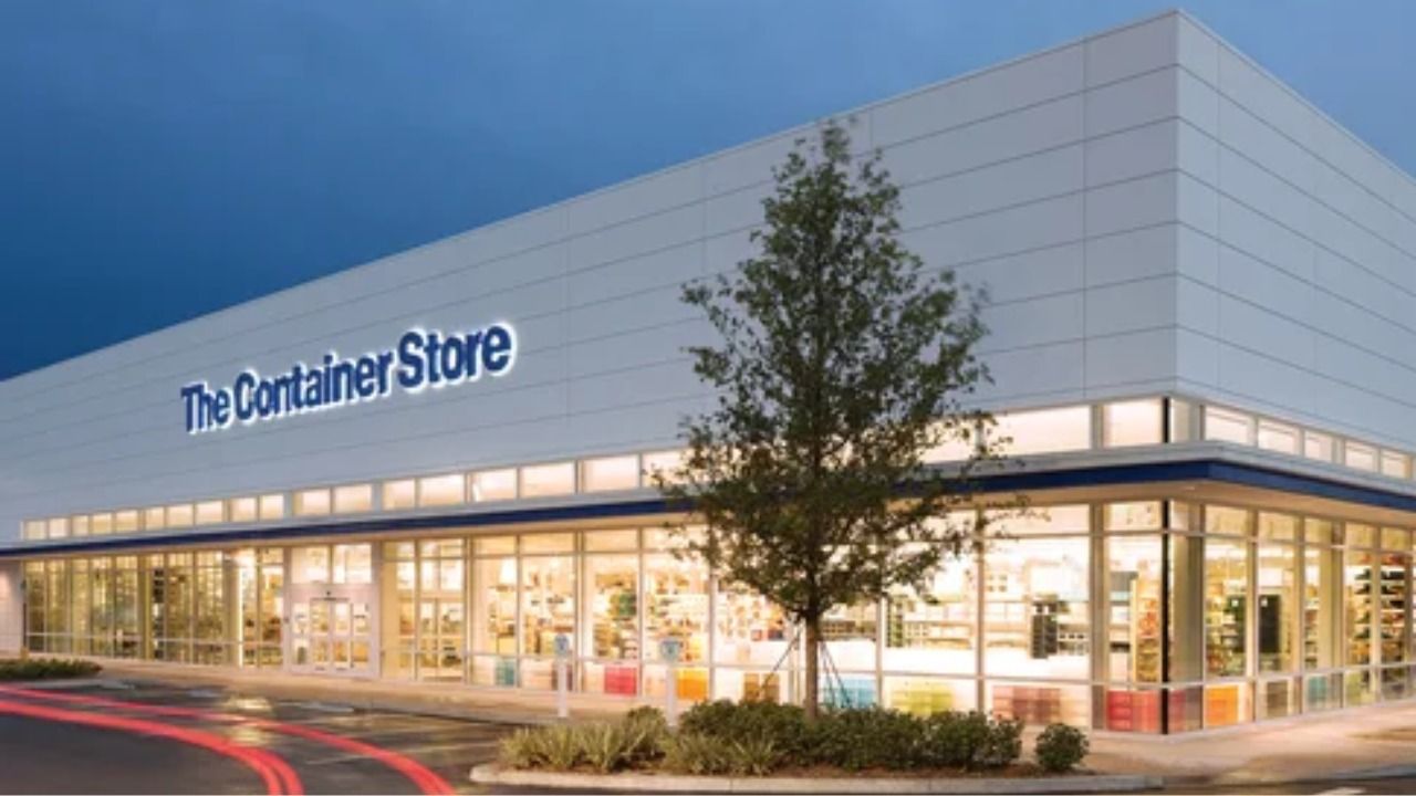 The Container Store exterior with illuminated storefront and glass display windows