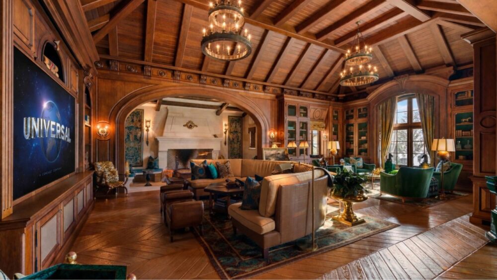 Wood-paneled living room inside Thonotosassa estate with vaulted ceilings and fireplace