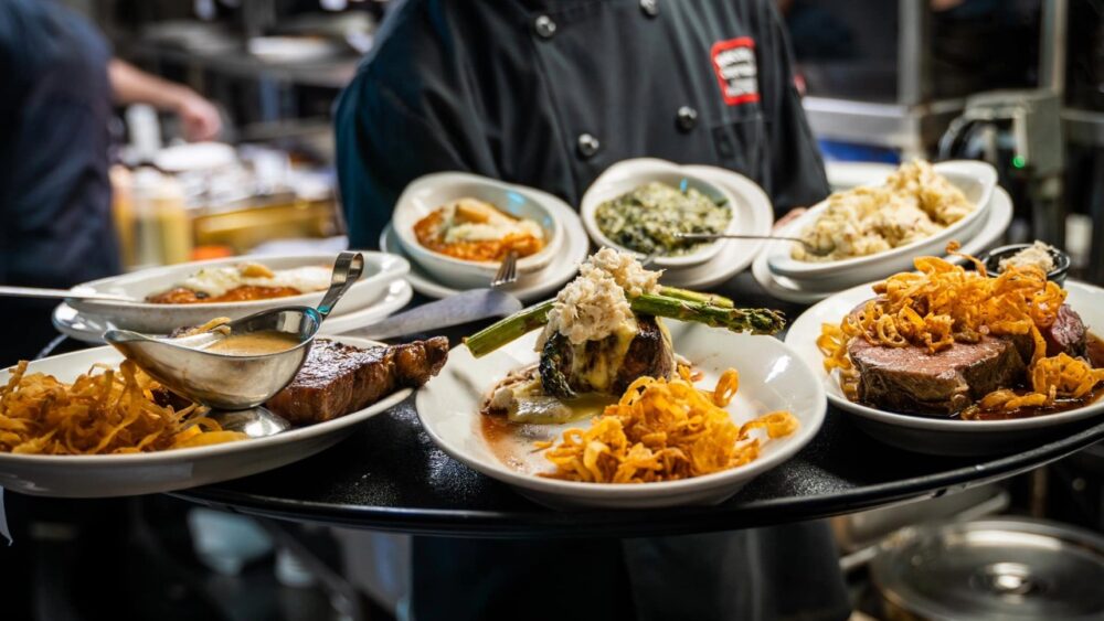 Steakhouse dishes including filet, ribeye and sides prepared in Bascom’s Chop House kitchen