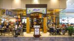 Columbia Restaurant café location inside Tampa International Airport with travelers dining
