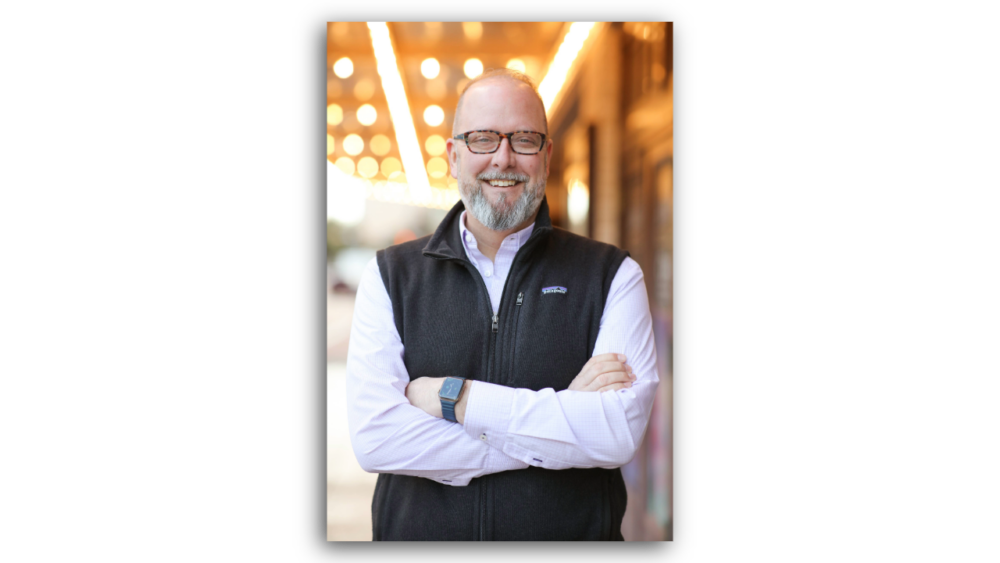 George Levesque, incoming CEO of Tampa Theatre, standing outdoors with arms crossed