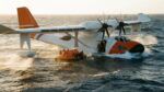 Amphibious aircraft conducts ocean rescue operation with crew boarding liferaft at sea