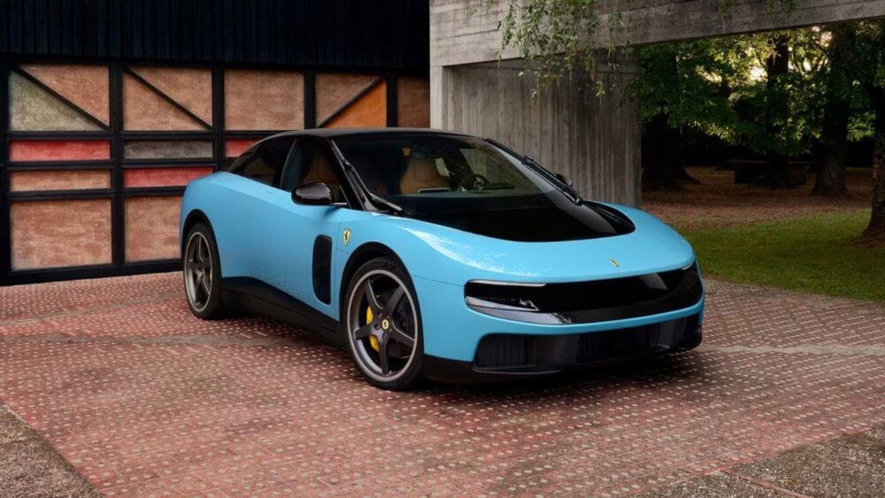 The Ferrari Luce, Ferrari’s first fully electric vehicle, parked outside a modern building in light blue paint.