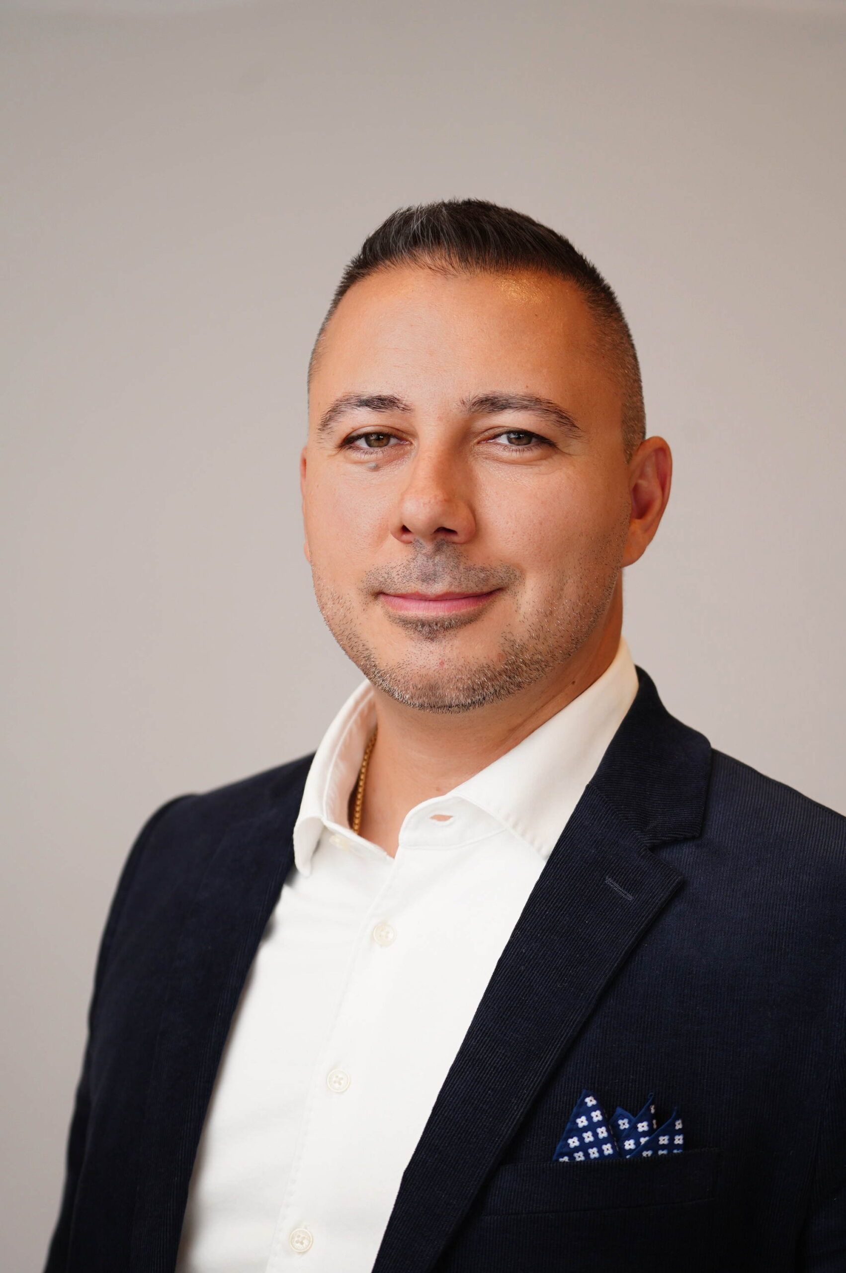 Headshot of Petar Besalev, executive vice president of cybersecurity and compliance services at A-LIGN