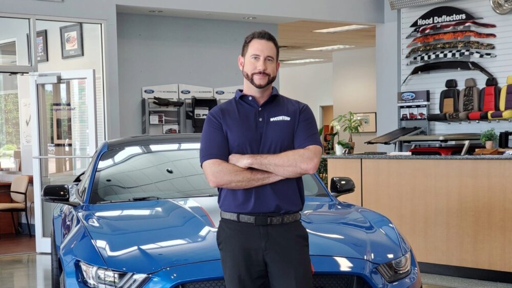 Benny Robles Jr., dealer principal of Bartow Ford, stands inside the dealership showroom in Bartow.