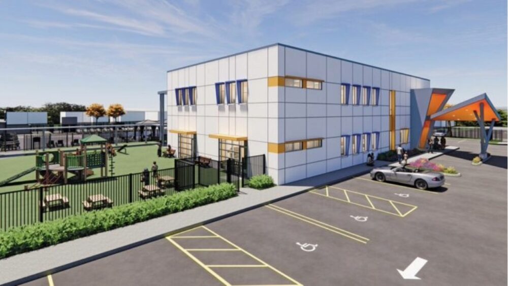 Rendering of a proposed preschool building at the Tampa Jewish Community Center campus, showing a two-story classroom facility, playground, covered walkways and parent drop-off area.