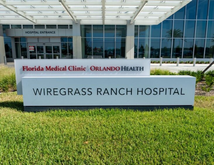 Entrance sign for Florida Medical Clinic Orlando Health's Wiregrass Ranch Hospital.