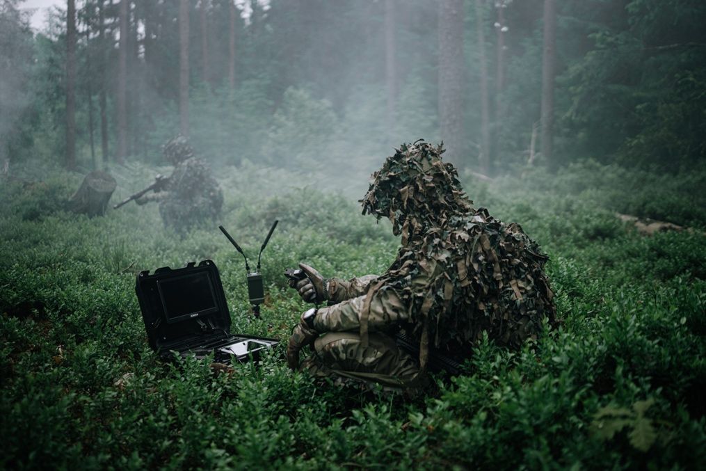 British Army soldiers operate XTEND autonomous drone systems during a military training exercise.