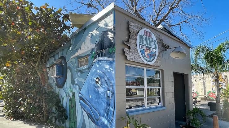 Exterior of Big Ray's Fish Camp in South Tampa, featuring a colorful fish mural on the building after the restaurant was named to Michelin's national seafood shack list.