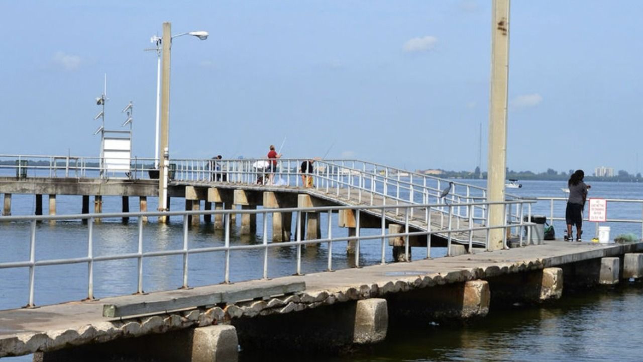 Fishing pier at Picnic Island Park in Tampa, where the city is planning a coastal restoration project featuring nature-based shoreline improvements.