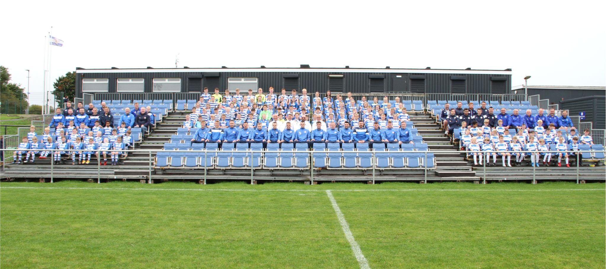 Kilwinning Rangers FC players, youth teams and staff gathered in the stands at the club's stadium in Scotland