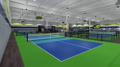 Rendering of an indoor PickleRage pickleball club with multiple blue and green courts.
