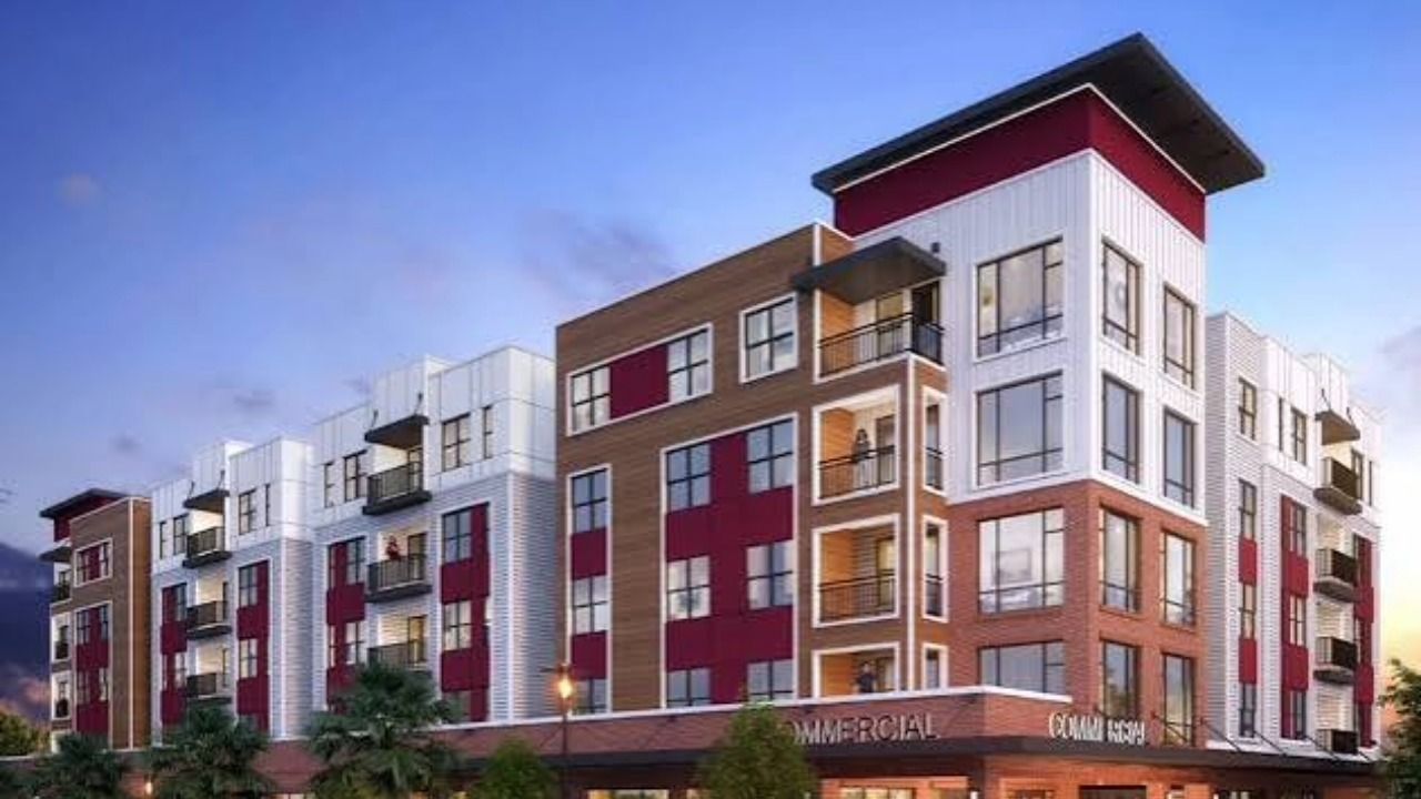 Rendering of a multistory student housing development with ground-floor commercial space