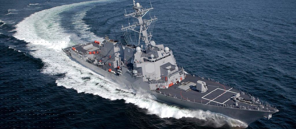U.S. Navy destroyer traveling at sea, equipped with the MK 41 Vertical Launching System