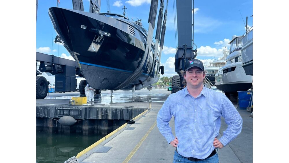 Space Grid AI founder Alex Hilger at a shipyard as a large vessel is lifted from the water
