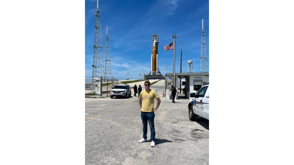 Space Grid AI founder Alex Hilger at a shipyard as a large vessel is lifted from the water