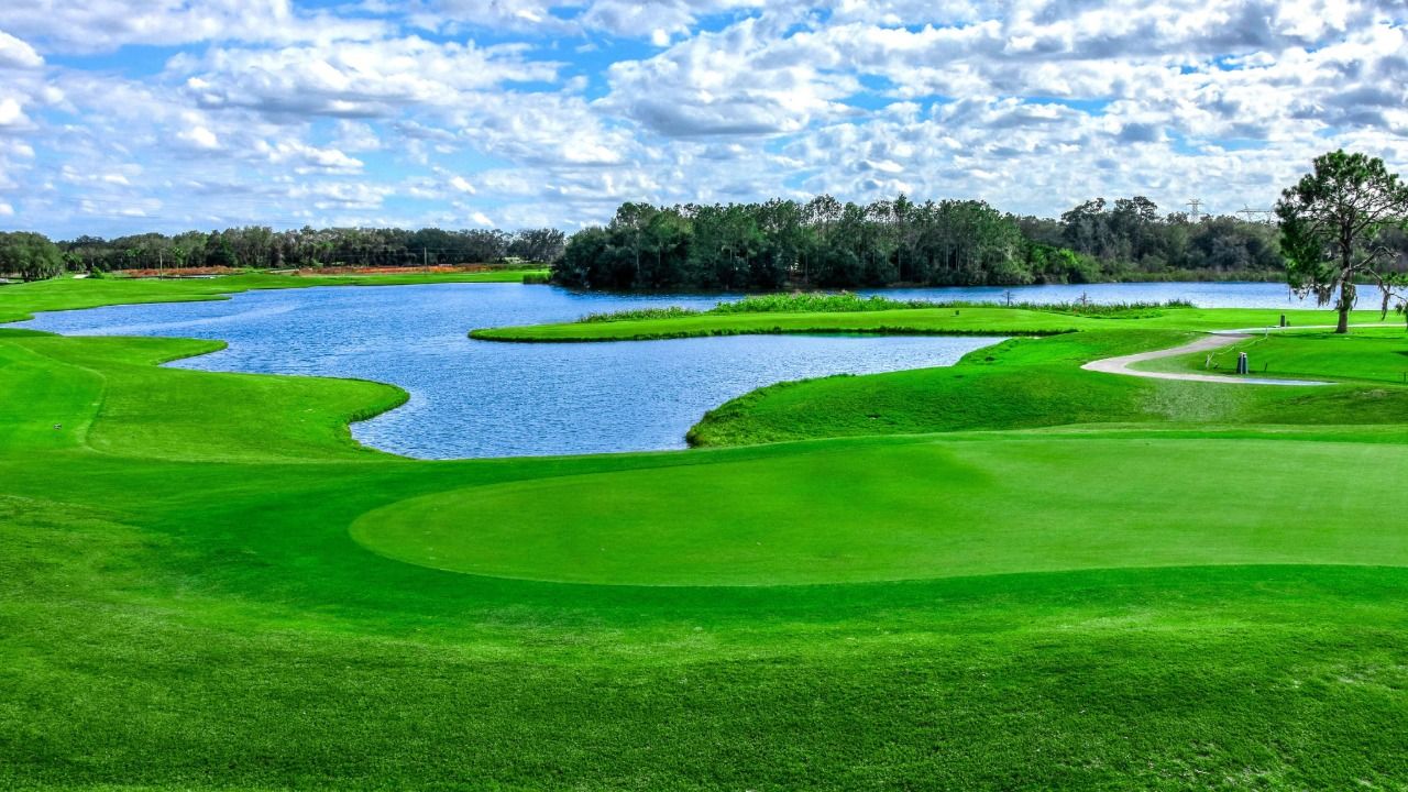 Fox Hollow Golf Club in Trinity, Florida, featuring a lakeside green and fairways.